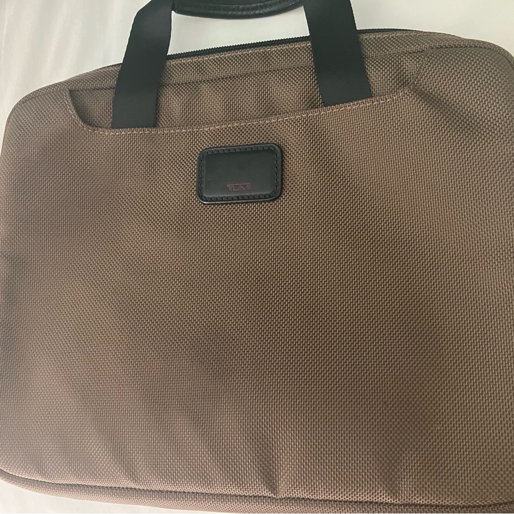 Tumi Brown Tablet case 
Chocolate brown with Strap